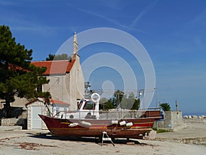 A wooden fisherman boat ashore on Premuda