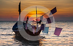 Wooden fishery boat floting on the sea