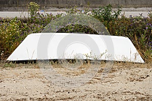 Wooden fishing boat dries ashore