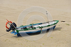 Wooden fishing boat dries ashore