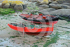 Wooden fishing boat dries ashore