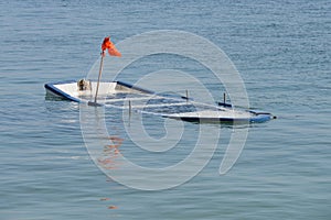 Wooden fishing boat submerged in water