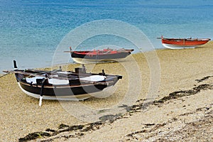 Wooden fishing boats dry on the seashore