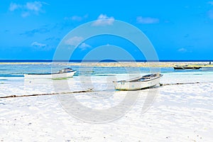 Wooden fishing boats at the sandy beach at Zanzibar island, Tanzania