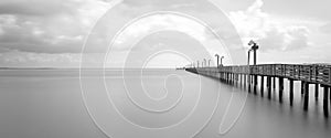 Wooden fishing pier in La Porter, Texas, USA in long exposure, b