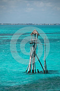 Wooden fishing tower hut / cabin on the Mexican island called Isla Mujeres Island of the Women