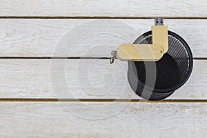 Wooden flash drive in trash can on white background