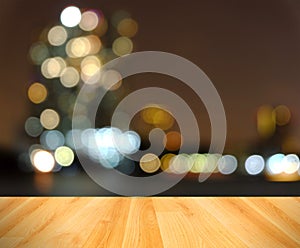 Wooden floor and abstract blurred city light,Bangkok Thailand