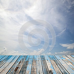 Wooden floor with beautiful blue sky scenery for background.