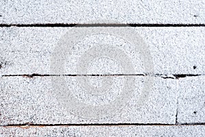 Wooden floor covered with fresh snow. Christmas and winter background.