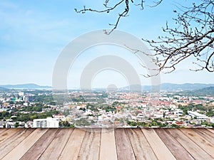 Wooden floor over aerial view of cityscape