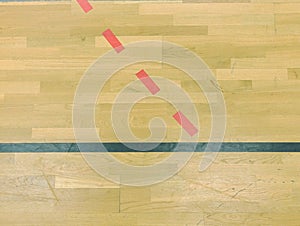 Wooden floor in sporting hall with solid and dotted lines. Light reflection