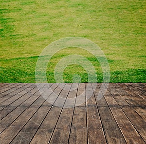 Wooden floor texture of terrace with green lawn