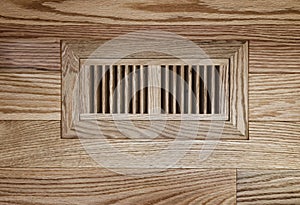 Wooden floor vent on oak floor