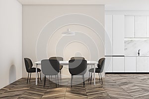 Wooden floor white kitchen with table