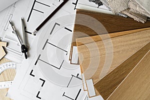 Wooden flooring samples, home floor plans, building structural blueprint projects, accessories for architect or interior designer.