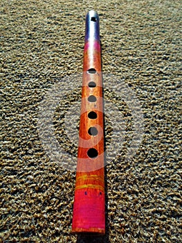 Wooden flute on non-smooth background