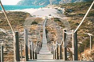 Wooden foot bridge in the beach