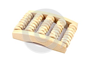 Wooden foot massage roller isolated on white