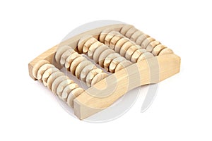 Wooden foot massage roller isolated on white