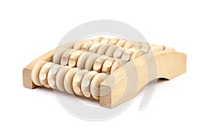 Wooden foot massage roller isolated on white