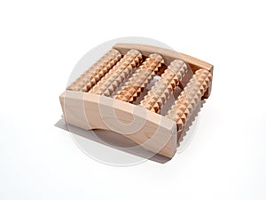 Wooden foot massager on a white background.