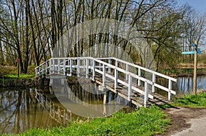 Wooden footbridge across a canal