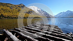 Wooden footbridge on Lower Multinskoe lake in the Altai Mountains