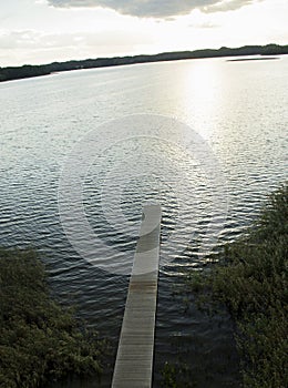 Wooden footbridge over the lake