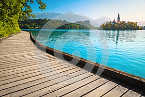 Wooden footbridge over the lake Bled and great view, Slovenia