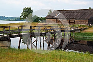 Wooden footbridge over pond