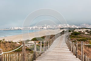 Wooden footpath at the beach. Portugal