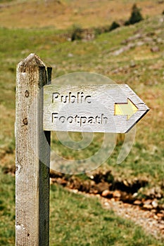 Wooden footpath signpost