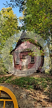 A wooden forest house in the forest, small and cute