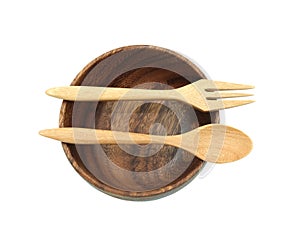 Wooden with fork and spoon put on middle circle bowl isolated on white background in clipping path. no people, no plastic safe t