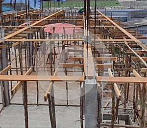 Wooden form work concrete foundation of building on construction site.