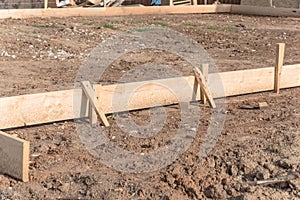 Wooden formwork concrete strip foundation for a new house