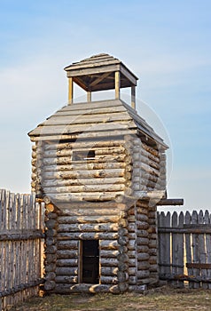 Wooden fortress in the field, old Russian wooden structure, village tower in the field