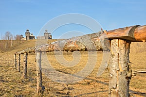 Wooden fortress in the field, old Russian wooden structure, village tower in the field