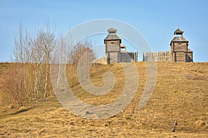 Wooden fortress in the field, old Russian wooden structure, village tower in the field