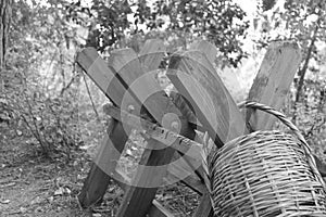 Wooden frame with a hanging straw basket