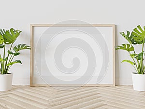 Wooden frame leaning on floor in interior mockup. Template of a picture framed on a wall 3D rendering
