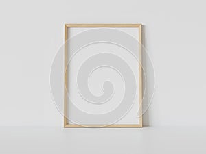 Wooden frame leaning on white floor in interior mockup. Template of a picture framed on a wall 3D rendering