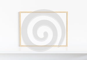 Wooden frame leaning on white shelve in bright interior mockup 3D rendering