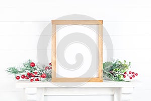 Wooden frame on a mantelpiece with branches - autumn theme photo