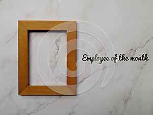 A wooden frame on the marble wall. Employee of the month.