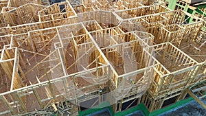 Wooden frame of new american apartment condo under construction. Development of residential housing in the USA