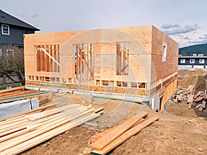 Wooden frame of a new house with engineered lumber materials in front