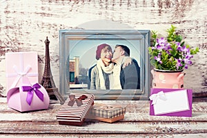 Wooden Frame with picture of young couple and romantic accessories