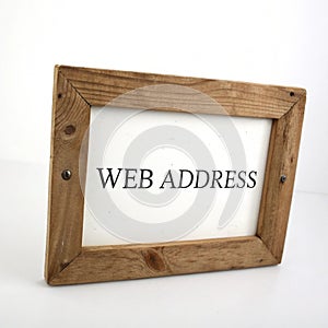 Wooden frame with a web address isolated on white background photo